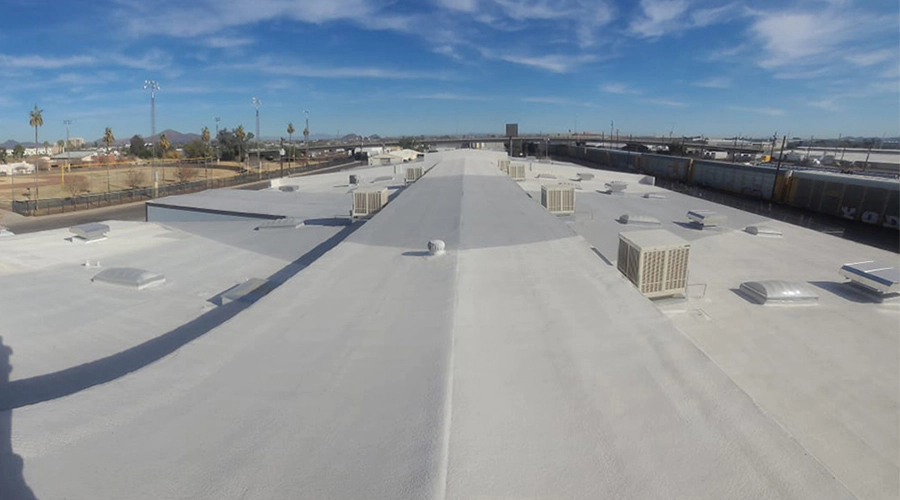 large white commercial roof and clear skies